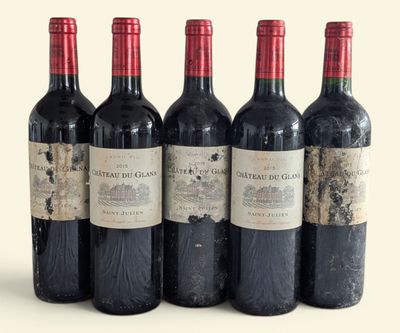 four bottles of wine are lined up in a row