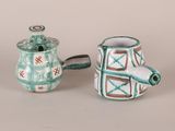 two teapots sitting next to each other on a table