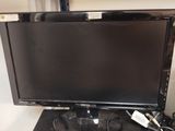 un écran d'ordinateur et un clavier posés sur un bureau