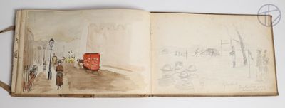 an open book with a drawing of a red bus on it