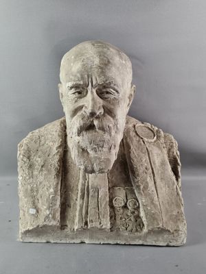 statue of a man with a beard and a moustache on a gray background
