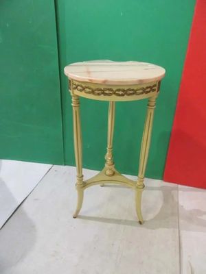 a small table that has a marble top on it