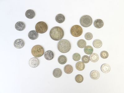 a lot of coins that are on a white surface