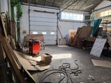a room with a lot of wood and a machine in it