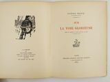 an open book with a picture of a man on a chair