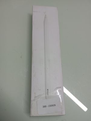 a white candle that is in a box on a table