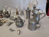 a table with a lot of silver items on it