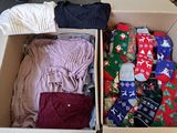 a box full of clothes and socks sitting on the floor