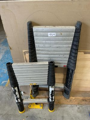 a stack of tools sitting on a pallet next to a box