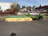 a picture of a tractor and a plow in a parking lot