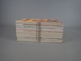 several books stacked on top of each other on a table