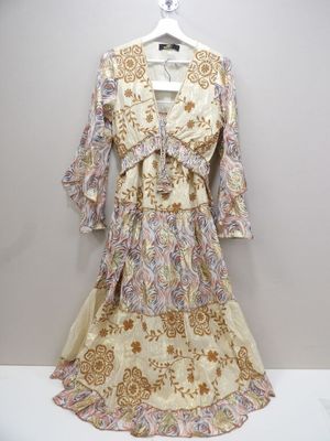 the dress is hanging on a hanger on the wall