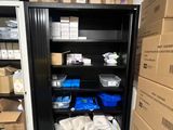 a refrigerator with many boxes on the shelves in the room