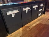 a picture of a bar with a lot of drawers on it