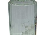 a green glass vase with a green base on a white background