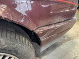 a close up of a car that has a dent in it