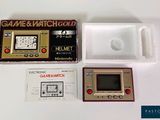 a game and watch gold box with a game in it