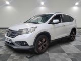 the white honda cr - v is parked on a checkered floor