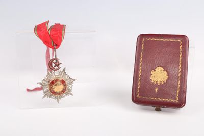 a red book and a red book with a gold star on it