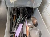 a drawer full of kitchen utensils in a kitchen