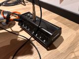 a cord connected to a power strip on a table