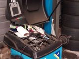 a blue machine that is sitting in a garage