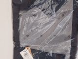 a bag of clothing wrapped in plastic on a table