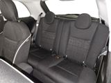 the back seats of a car are black and white with black trims