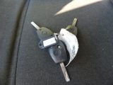 a car key that is attached to a car seat belt