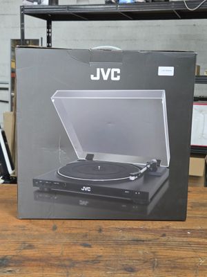 an open box of a record player sitting on top of a wooden table