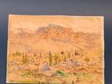 une vieille photo représentant un tableau représentant une scène désertique avec une montagne en arrière-plan