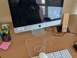 an image of a computer monitor and keyboard on a desk