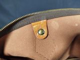 a close up of a purse with a zipper on it