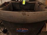 an image of a black bathtub sitting in a dirty room