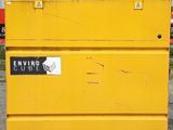 a close up of a yellow box with a sticker on it