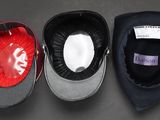 three hats are lined up on top of each other on a table