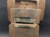 an image of a wooden sculpture of a man ' s head