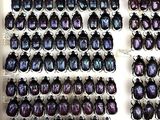 a lot of beetles that are on display in a box