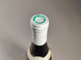 a bottle of wine that is sitting on a table