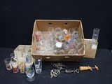 a box full of glasses and a bunch of keys