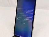 the back view of a black phone with a display on it