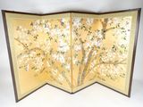 a folding screen with flowers and leaves on it