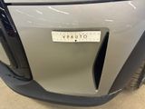 a close up of the front bumper of a car
