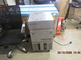 a stack of boxes and a chair in a room