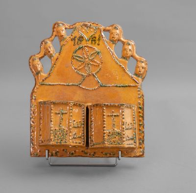 an image of a small wooden box with a design on it