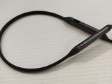 a pair of scissors sitting on a table next to a computer