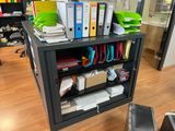 a desk with a bunch of folders on top of it