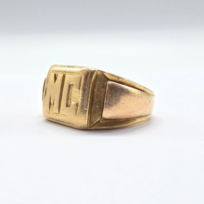 an image of a gold ring with a roman numeral on it