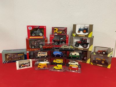 a lot of toy trucks that are sitting on a red table