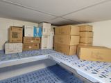 many boxes and boxes on the floor in a room
